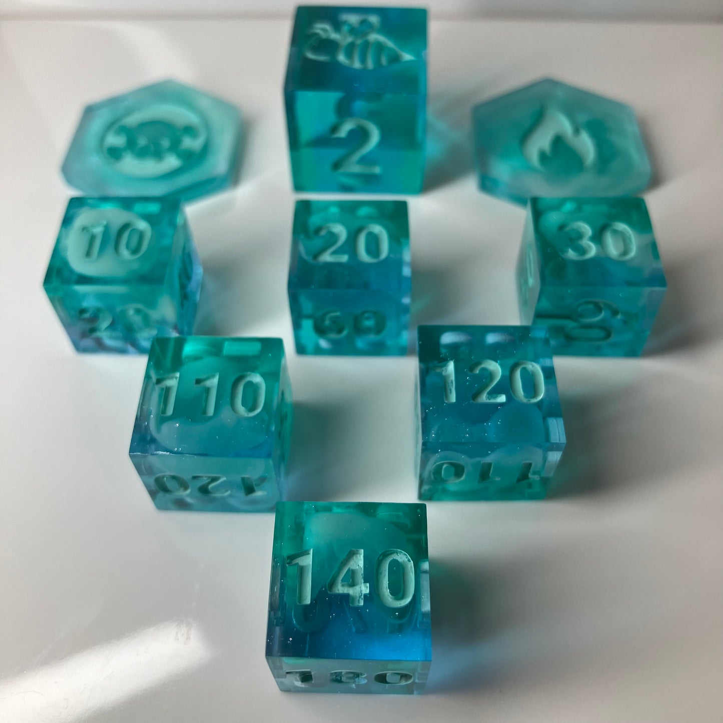Set of teal dice with clouds for the Pokemon TCG