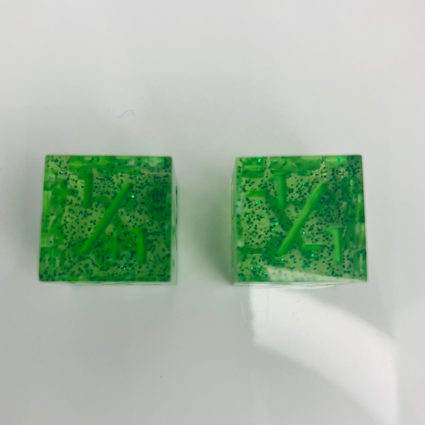 Two green square bars of soap with a speckled pattern for use with Magic The Gathering
