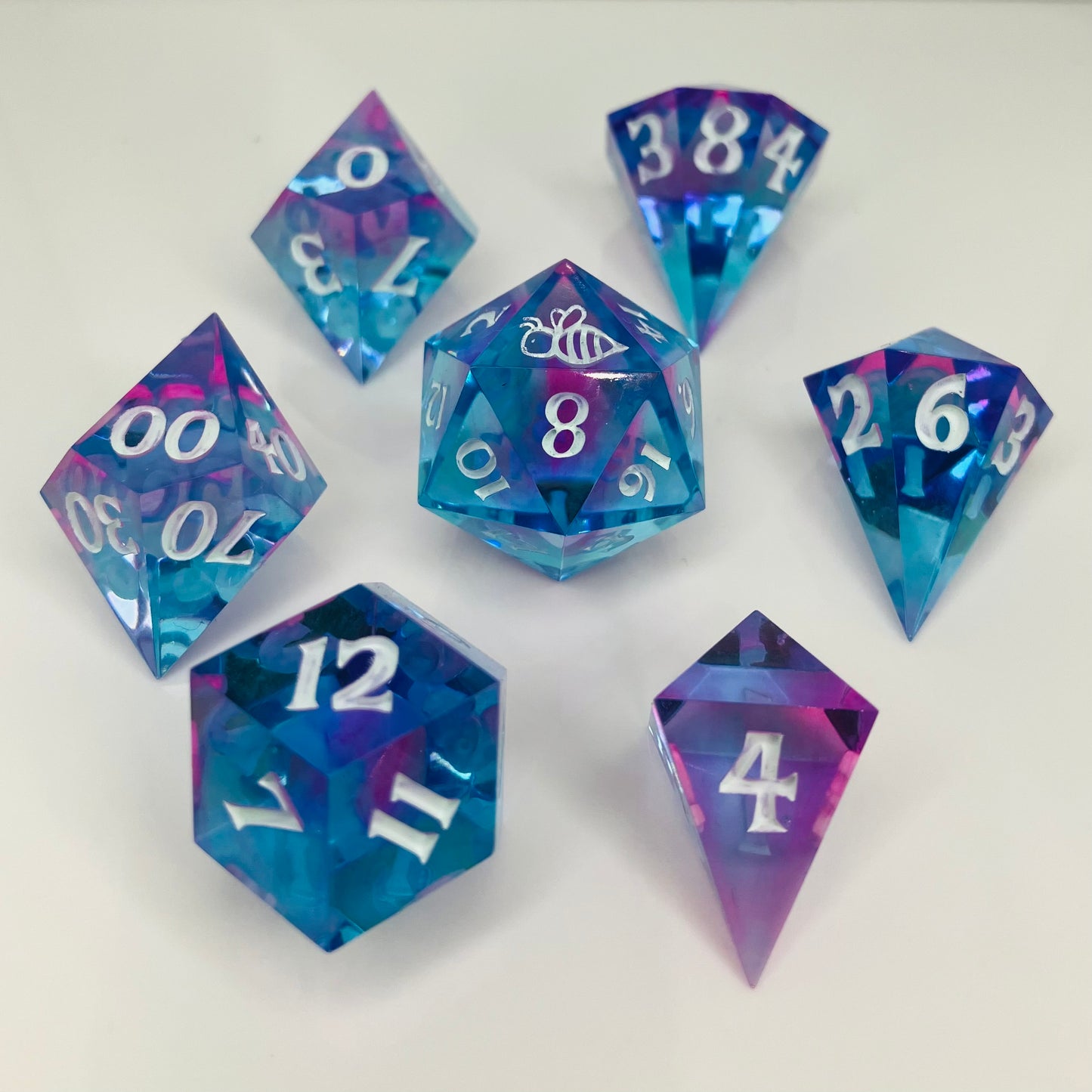 rainbow fluorite dice set in gemstone shapes for dnd pathfinder and other ttrpgs
