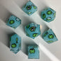 Teal dice set with happy and sad frogs on them.