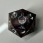 Copper, marble and silver come together in this hand made d20