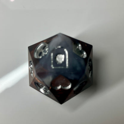 Copper, marble and silver come together in this hand made d20