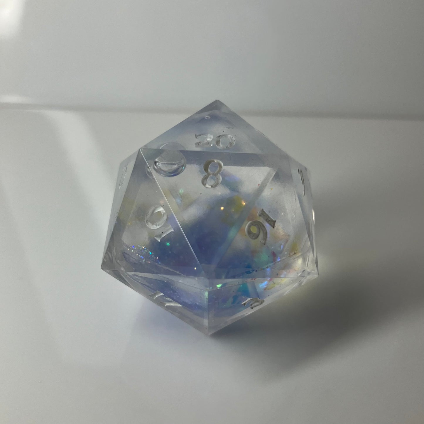 Clear liquid corel d20 with blue and yellow numbers 30mm chunk