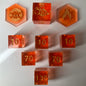Set of orange dice with gold numbers for the Pokemon
