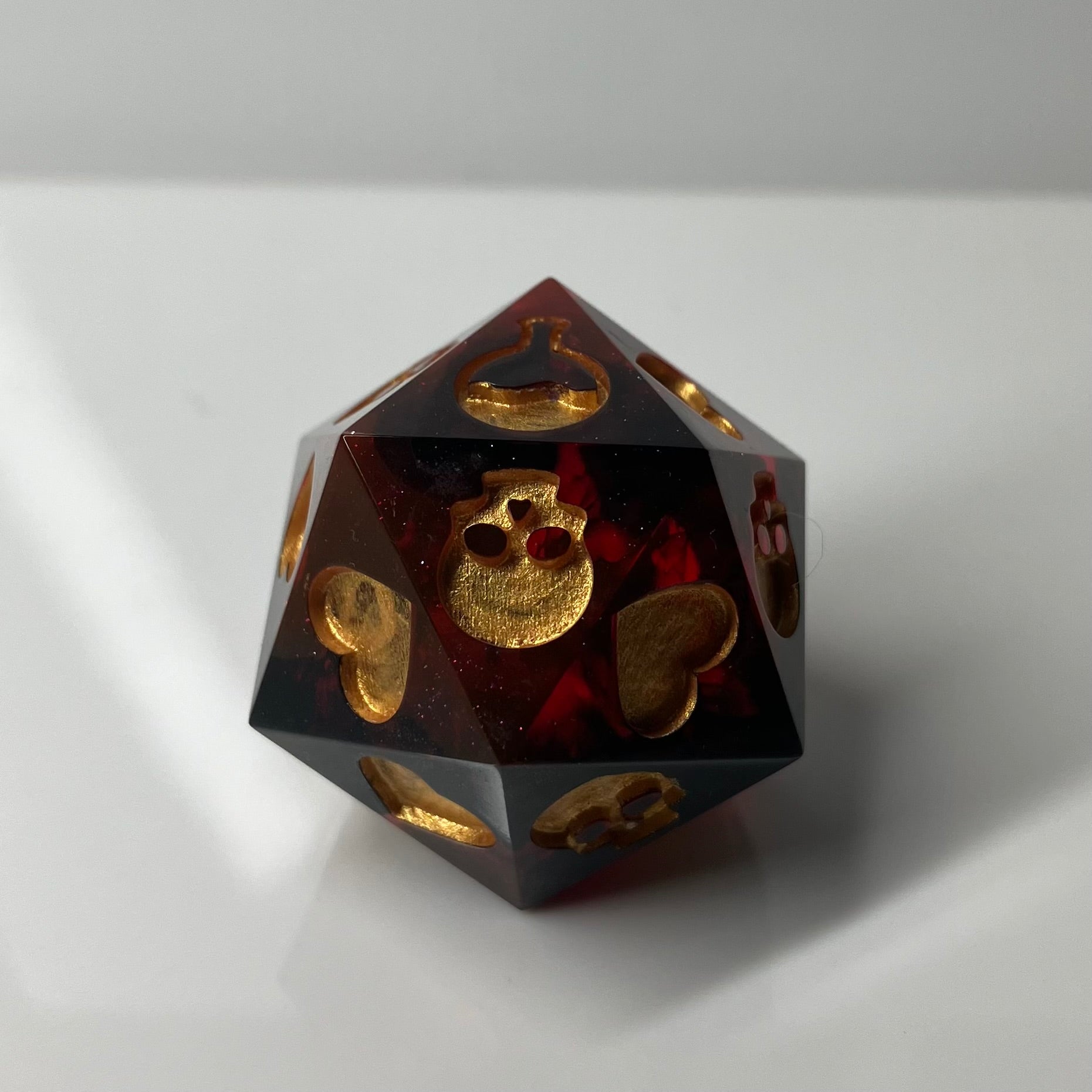 translucent red with wisps of black d20 death save with hand painted symbols