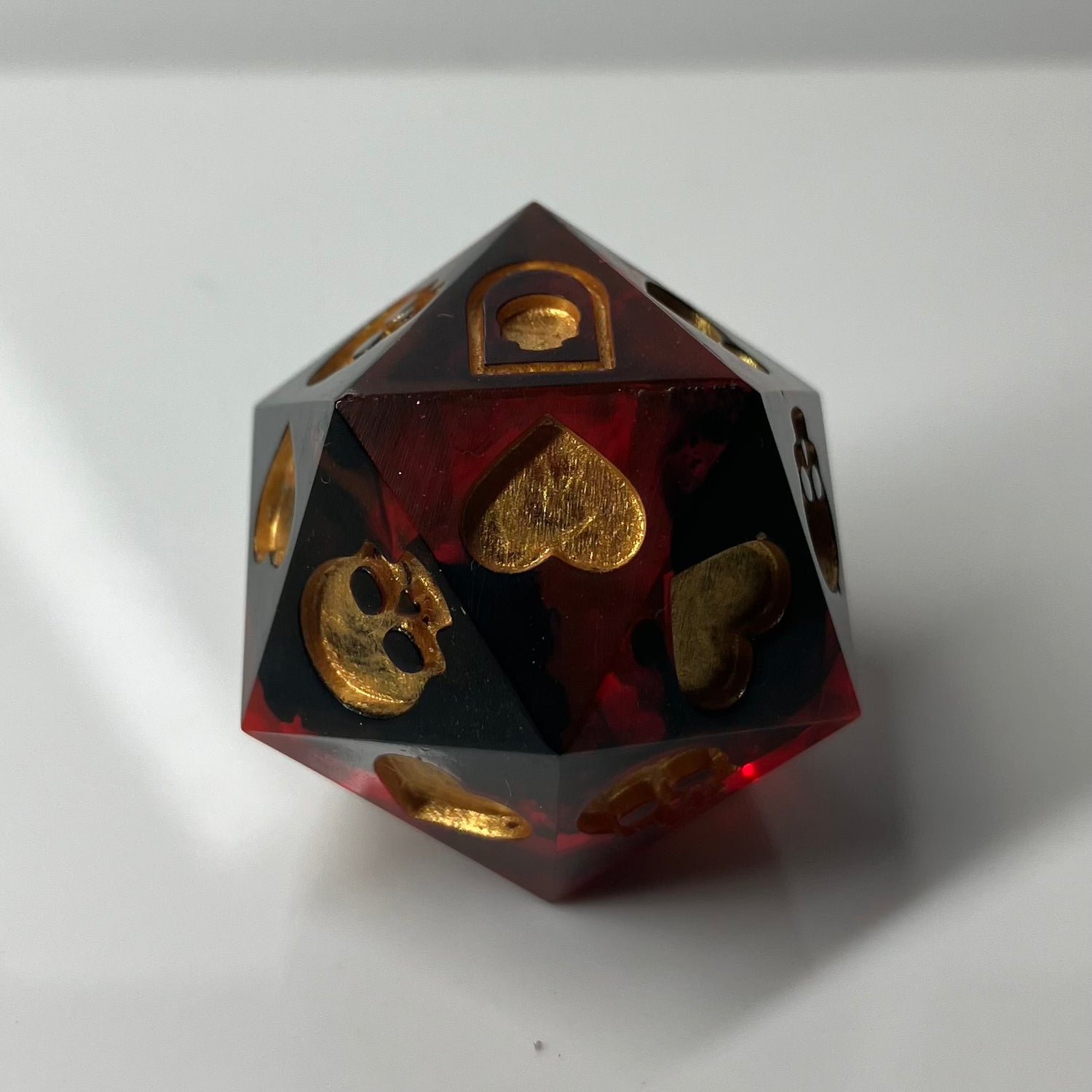 translucent red with wisps of black d20 death save with hand painted symbols