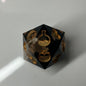black and gold d20 for rolling death saves 