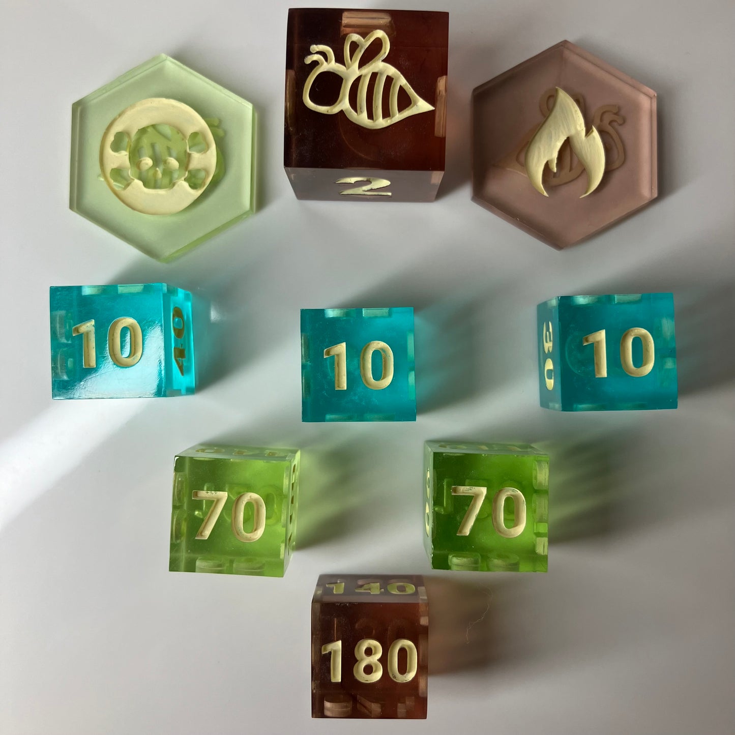 Set of colorful dice with various symbols and numbers for Pokemon TCG
