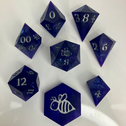 royal purple dice with numbers painted silver in gemstone shapes