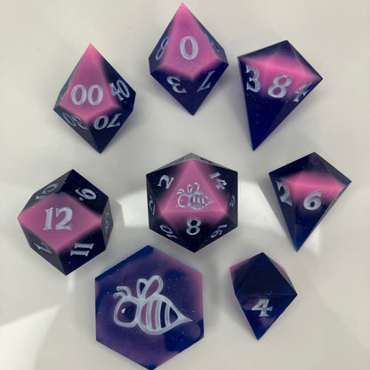 resin pink and blue dice with glitter and in unique shapes