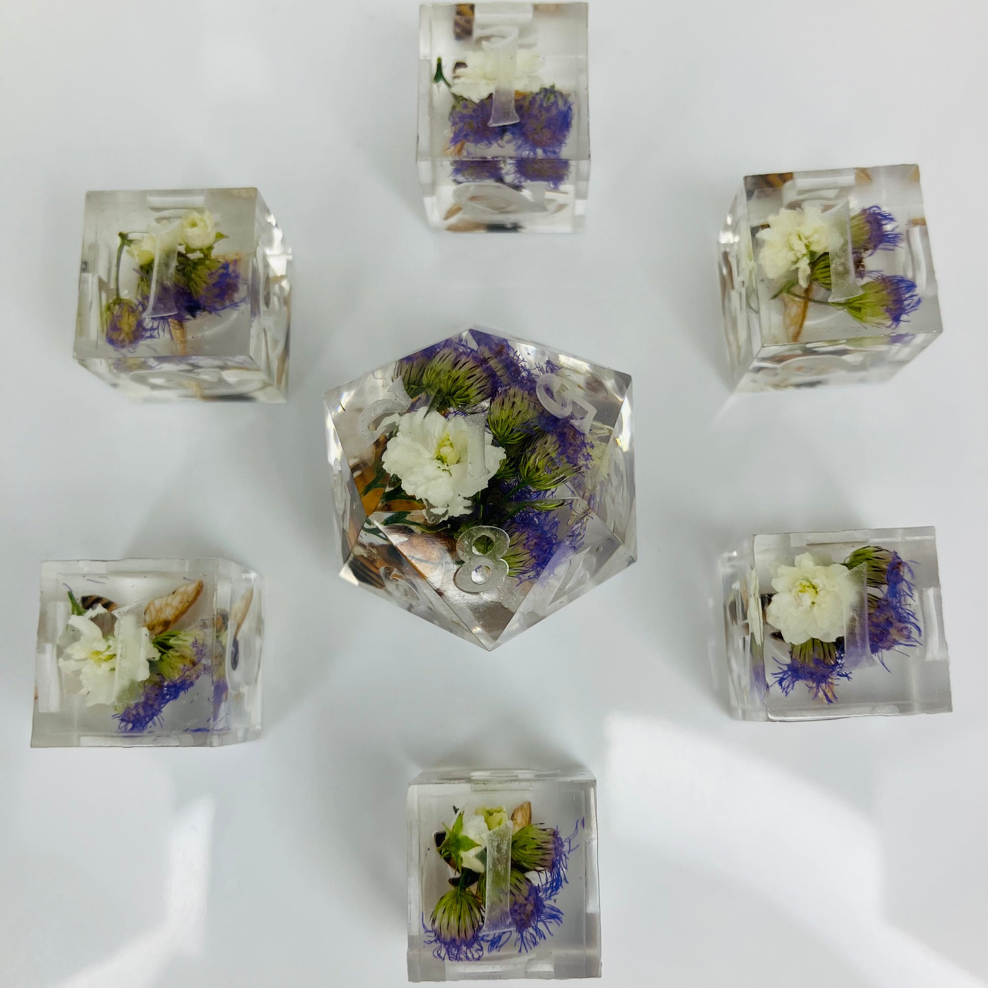 Clear cubes with pressed flowers and bees made for use with lorcana