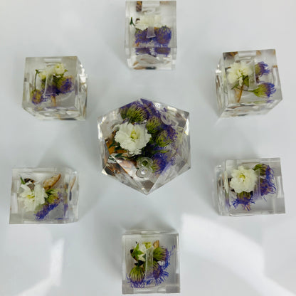 Clear cubes with pressed flowers and bees made for use with lorcana