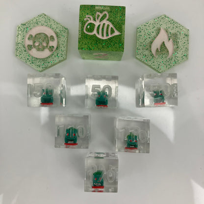 tiny hand painted bulbasaurs set in clear dice for the pokemon trading card game