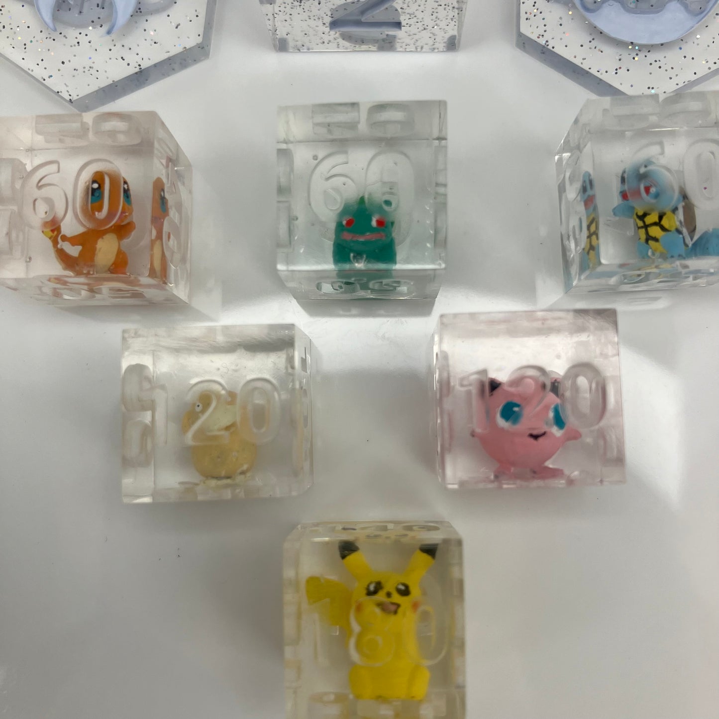 Hand painted pokemon set in clear dice