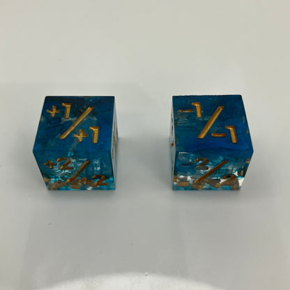 clear to blue d6 with positive and negative counters on them for MTG