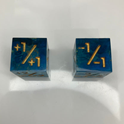 clear to blue d6 with positive and negative counters on them for MTG