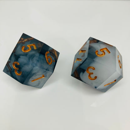black and grey daggerheart dice with gold numbers
