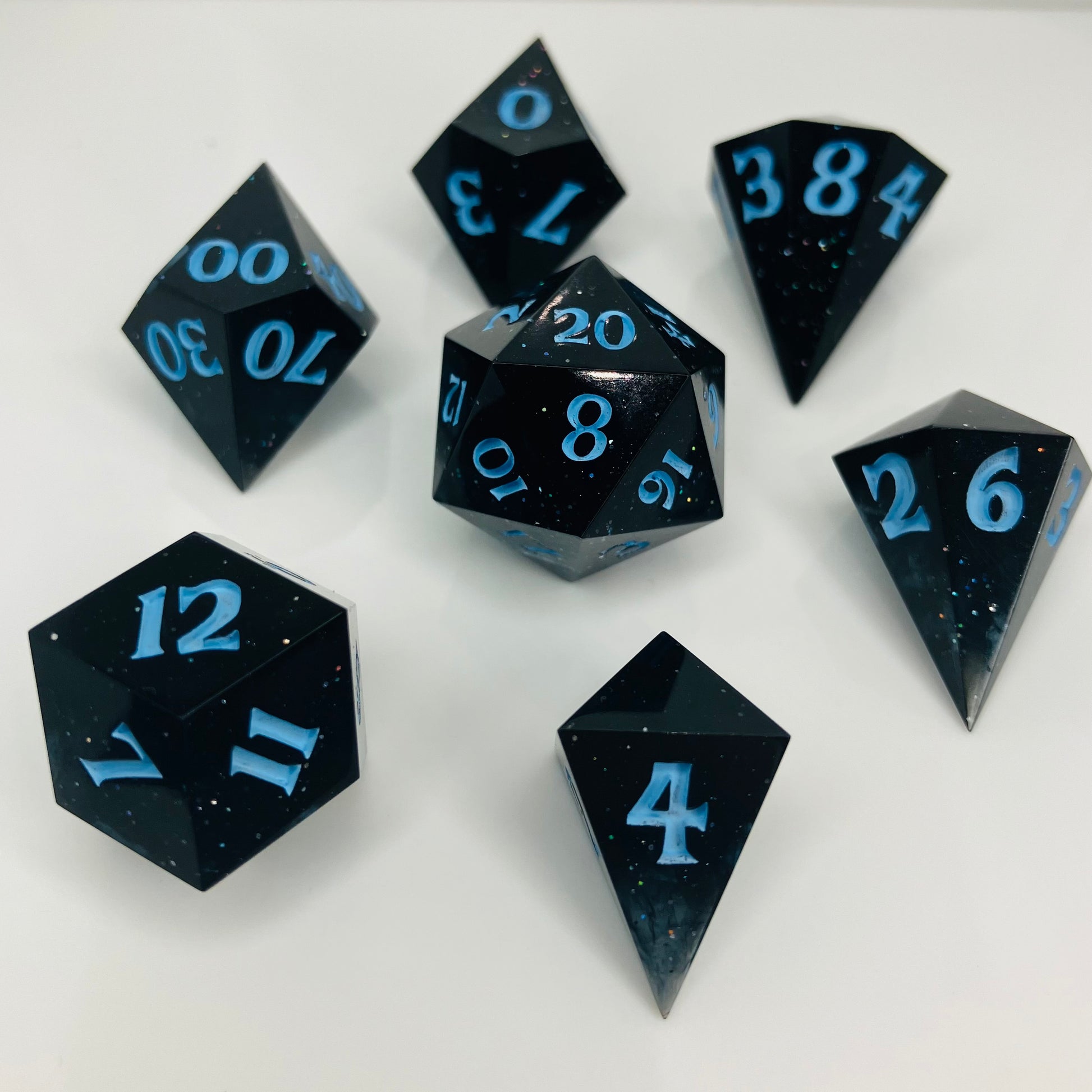 Clear to black galaxy gemstones set of gaming dice with sparkles.
