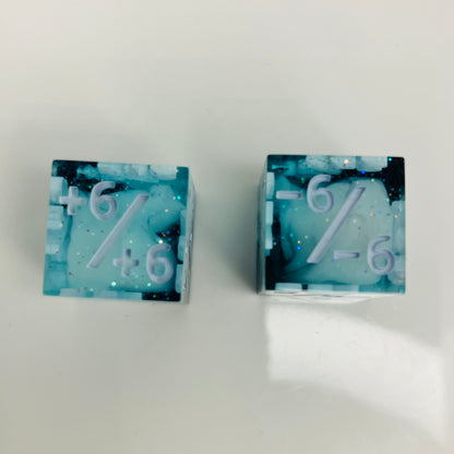 Two d6 dice with positive and negative counters
