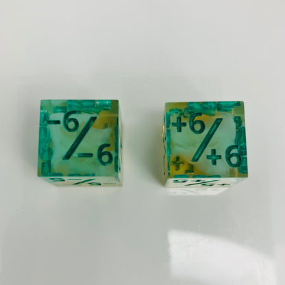 Green and yellow transparent dice with spore cloud inside.