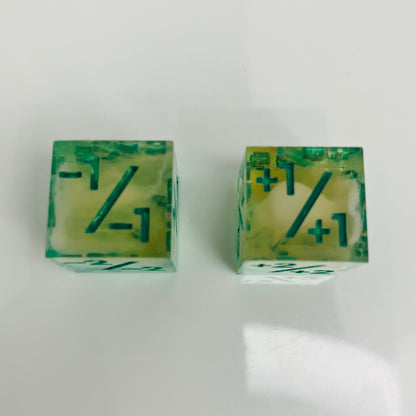 Green and yellow transparent dice with spore cloud inside.