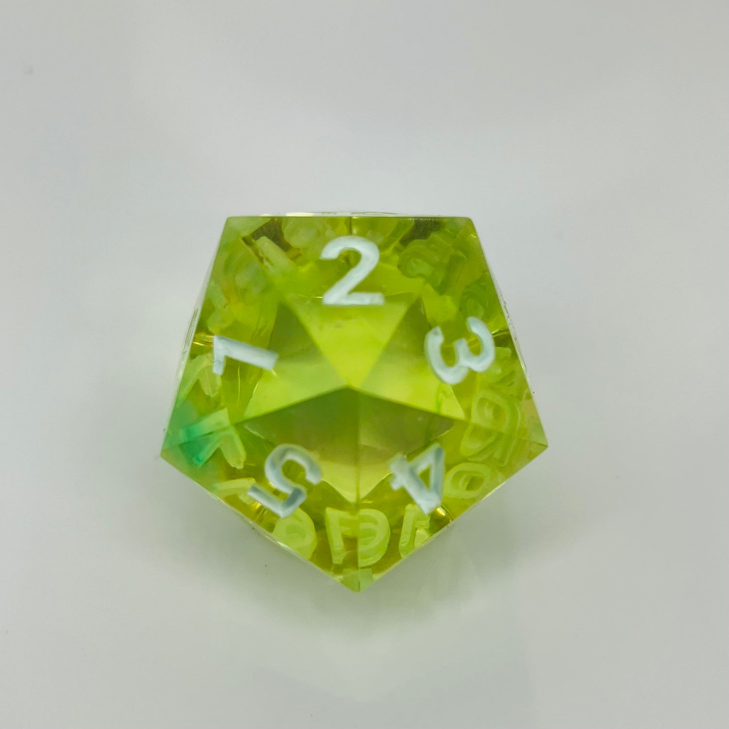 Bright and clear green and yellow spindown d20 with white numbers