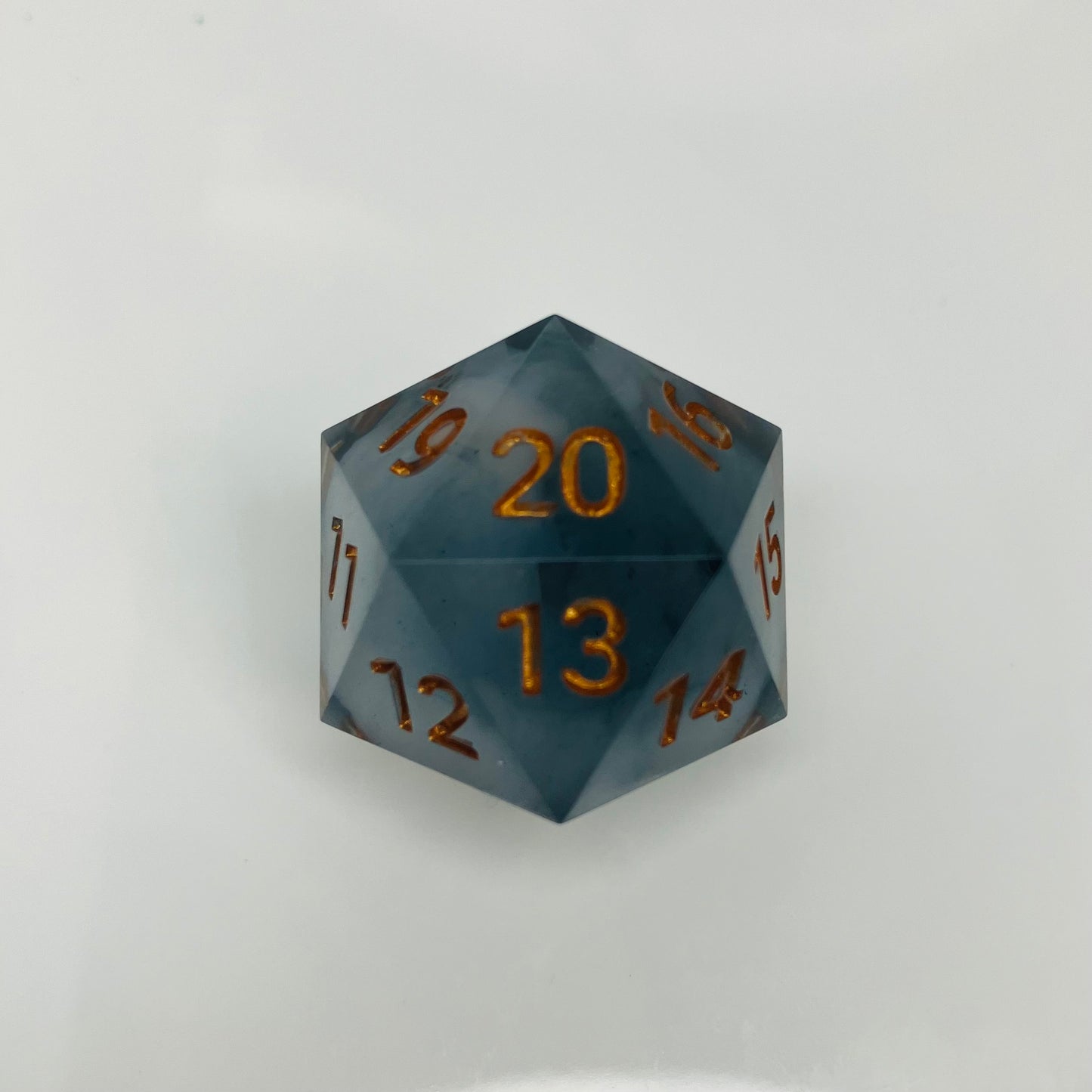 White cloud in dark grey spindown d20 with gold numbers