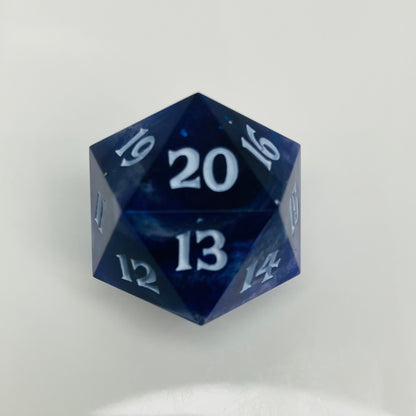 indigo and blue with silver swirls cast in a spindown d20