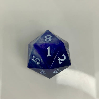 indigo and blue with silver swirls cast in a spindown d20