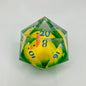 Yellow ducky laying on hand painted grass in a d20 chonk