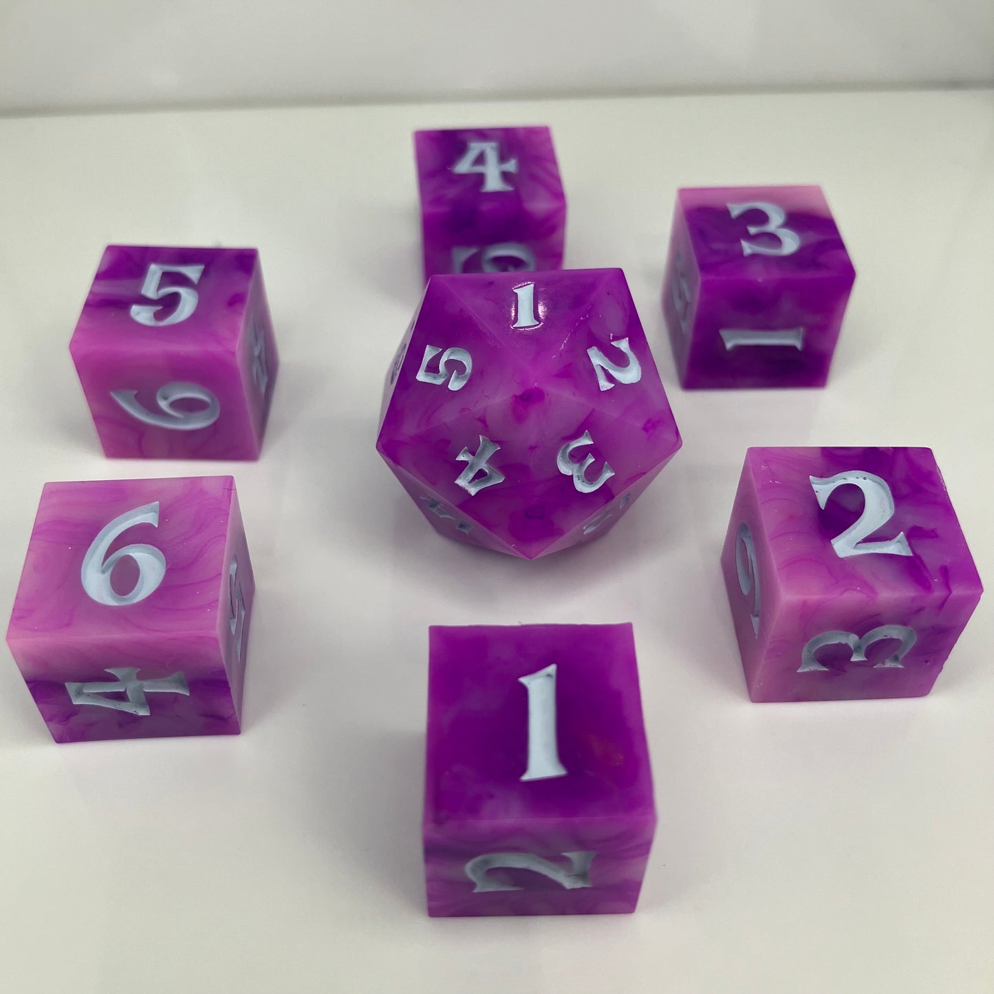 pink spindown d20 and d6 for use with lorcana